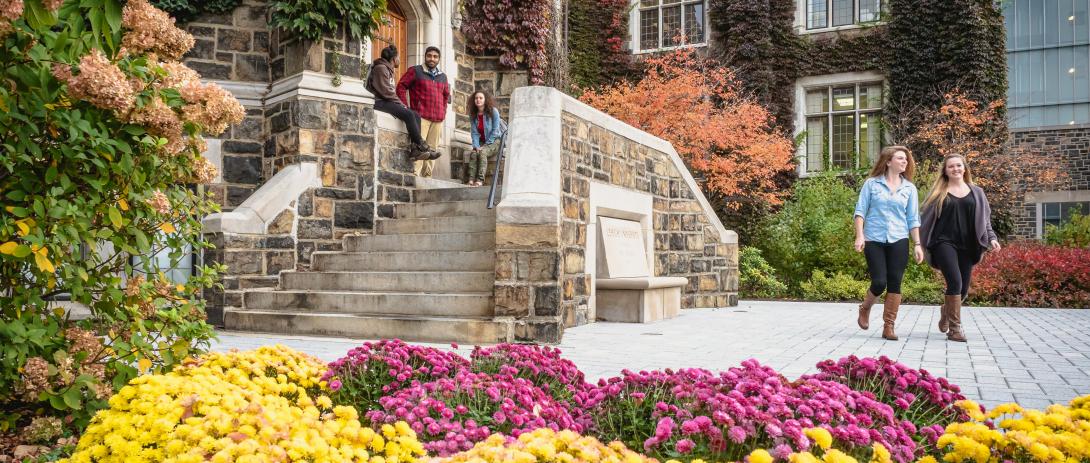 Lehigh student in front of Alumni Memorial building